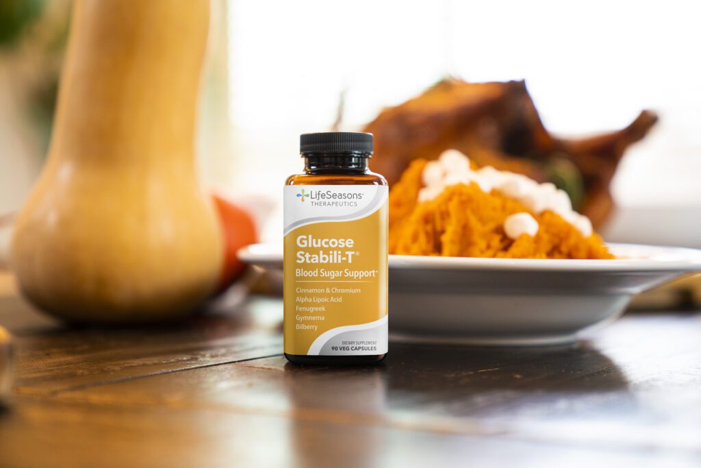 LifeSeasons Glucose Stabili-T supplement on a Thanksgiving table to support blood sugar during holiday meals.