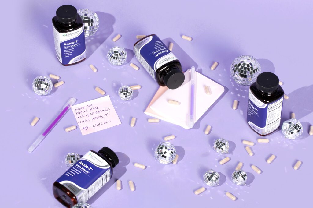 anxie-t bottles on a counter with supplements and a sticky note of errands that need to get done